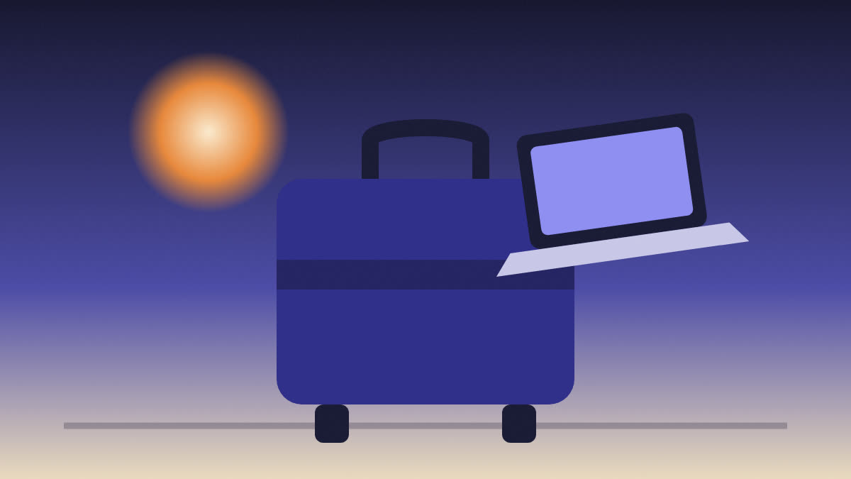 Valija de viaje con una notebook apoyada